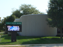 Dexter location with sign showing "100+ years of Lending Experience".